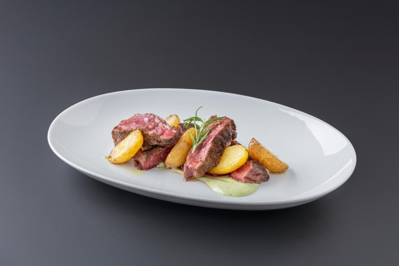 Eurostars Portico Alicante Eksteriør billede A steak with potatoes